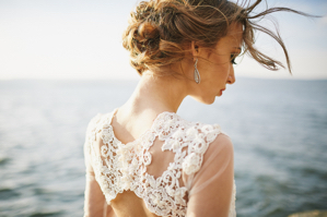 photoshoot lovers in a wedding dress in the mountains near the s